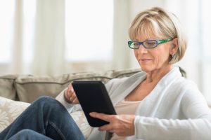 Retired woman looking at investments